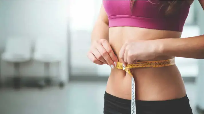 woman-measuring-stomach-1296×728 woman-measuring-stomach-1296x728